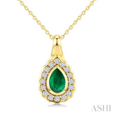 6X4 MM Pear Shape Emerald and 1/6 Ctw Round Cut Diamond Bold Precious Pendant With Chain in 10K Yellow Gold