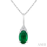 1/50 Ctw Oval Cut 6X4 MM Emerald and Round Cut Diamond Precious Pendant With Chain in 10K White Gold