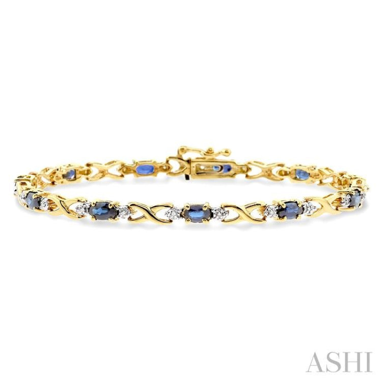 5x3 MM Oval Cut Sapphire and 1/10 Ctw Round Cut Diamond Bracelet in 10K Yellow Gold