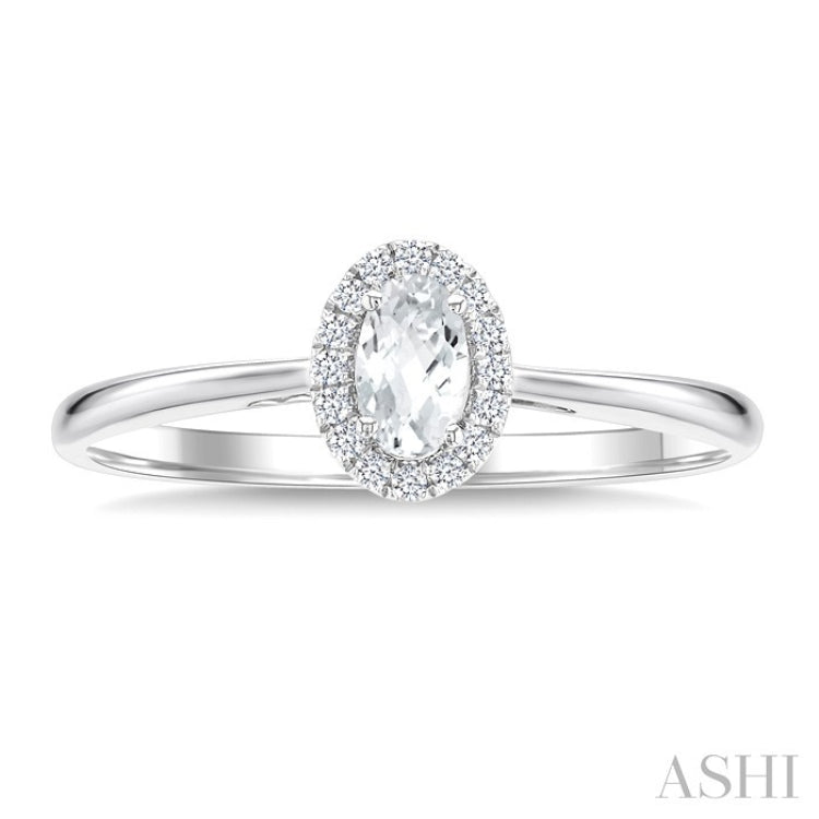 5x3 MM Oval Shape White Topaz and 1/20 Ctw Round Cut Diamond Halo Semi-Precious Ring in 10K White Gold