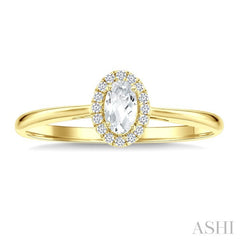 5x3 MM Oval Shape White Topaz and 1/20 Ctw Round Cut Diamond Halo Semi-Precious Ring in 10K Yellow Gold