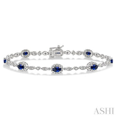 5x3 MM Oval Cut Sapphire and 1/20 Ctw Round Cut Diamond Bracelet in 14K White Gold