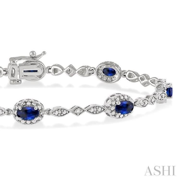 5x3 MM Oval Cut Sapphire and 1/20 Ctw Round Cut Diamond Bracelet in 14K White Gold