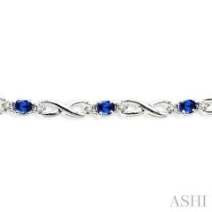 4x3 MM Oval Cut Sapphire and 1/10 Ctw Round Cut Diamond Bracelet in 10K White Gold