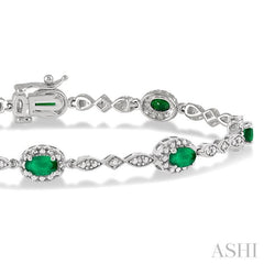 5x3 MM Oval Cut Emerald and 1/20 Ctw Round Cut Diamond Bracelet in 14K White Gold