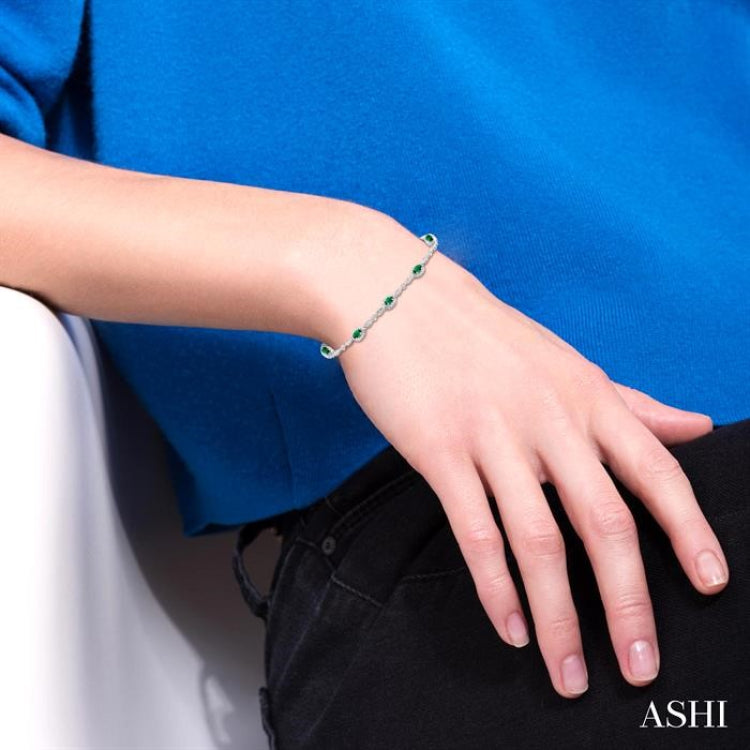 5x3 MM Oval Cut Emerald and 1/20 Ctw Round Cut Diamond Bracelet in 14K White Gold