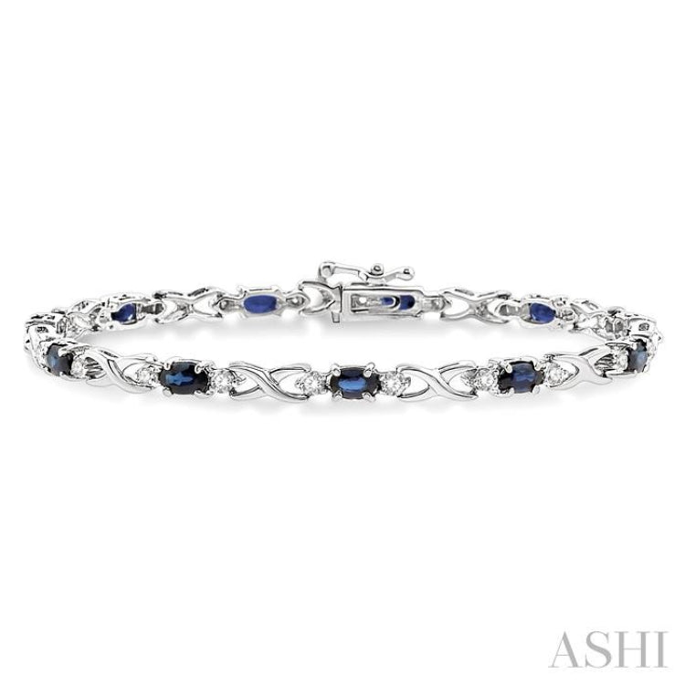 5x3 MM Oval Cut Sapphire and 1/10 Ctw Round Cut Diamond Bracelet in 10K White Gold