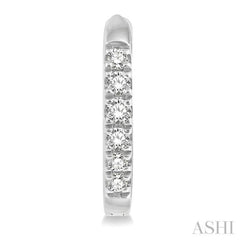 1/8 Ctw Round Cut Diamond Huggie Petite Earrings in 10K White Gold
