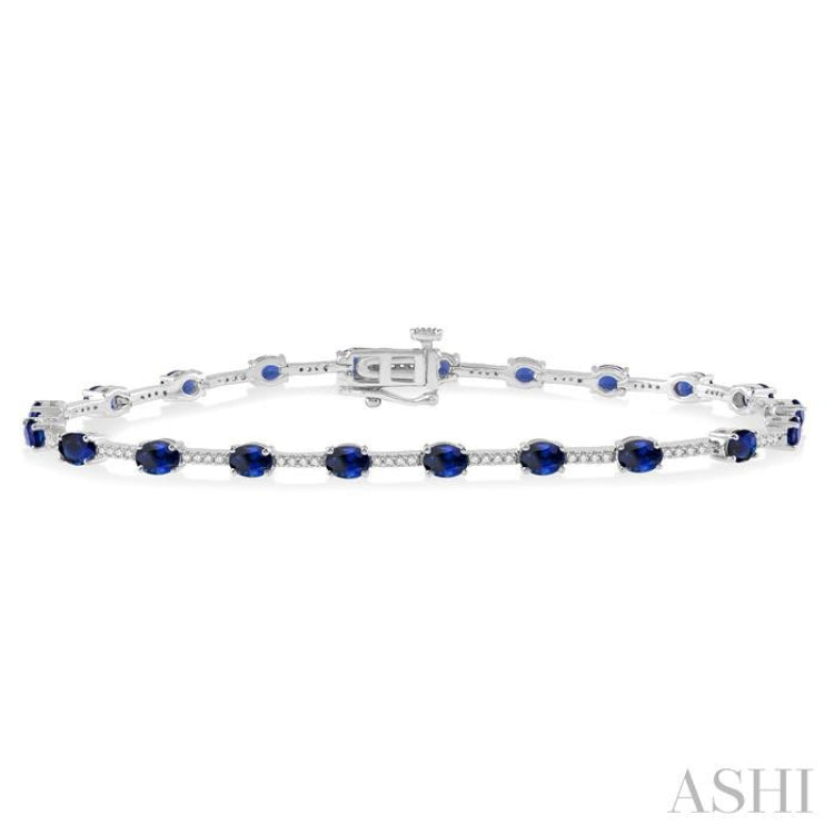4x3 MM Oval Cut Sapphire and 1/3 Ctw Round Cut Diamond Precious Bracelet in 10K White Gold