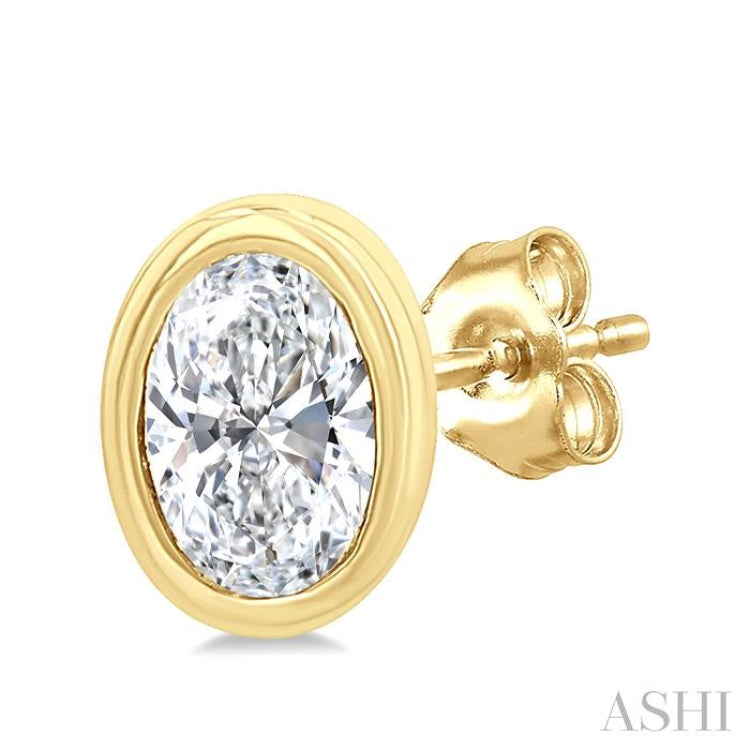 1/5 Ctw Petite Bezel Set Oval Cut Diamond Fashion Stud Earrings in 10K Yellow Gold
